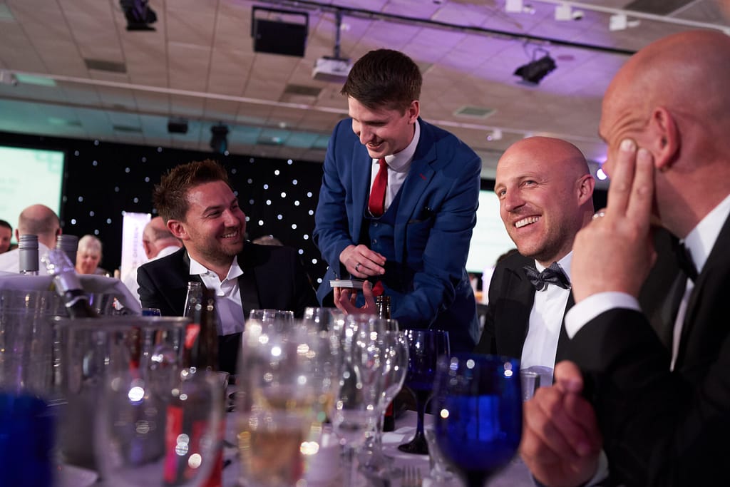 Professional magician engaging colleagues at a company event in Surrey.