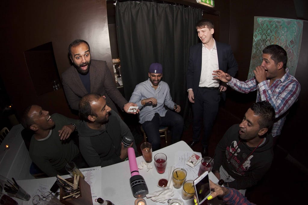 Close-up magician performing at a private party in London.