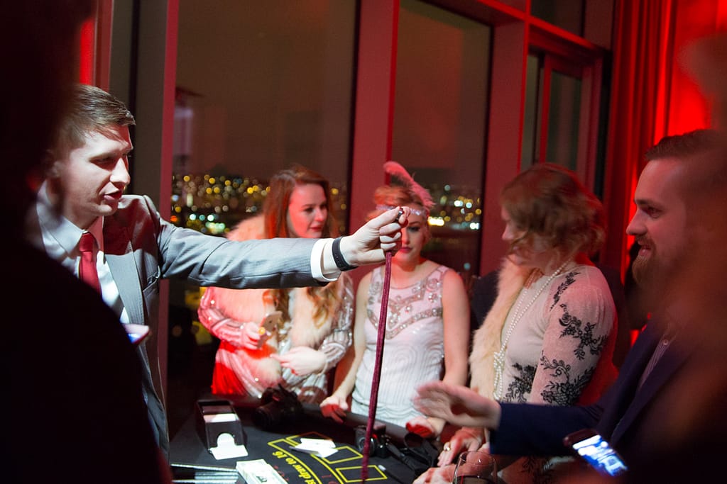 Guests enjoying interactive magic at a birthday celebration in Kent.