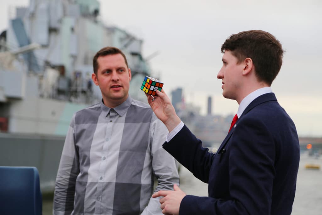 Close-up magician performing table-to-table at an event in London.