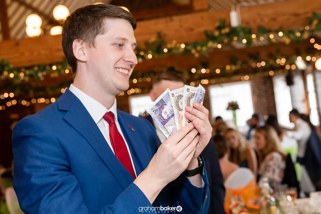 Magician Pete James working the room at an event in Kent.
