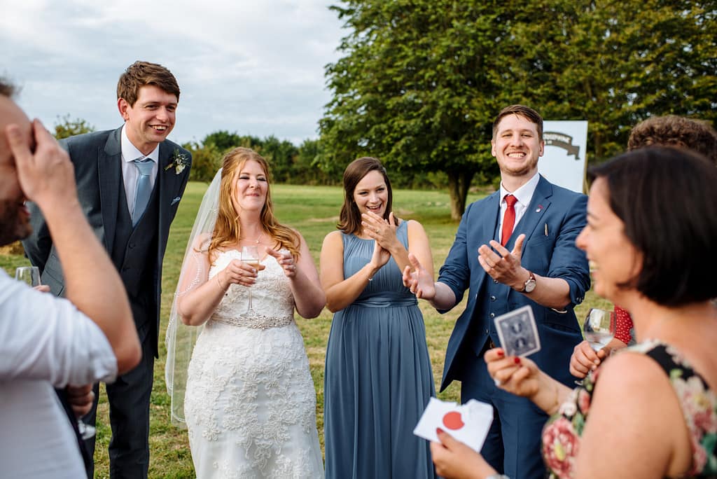 Professional magician entertaining wedding guests with sleight of hand in Sevenoaks.