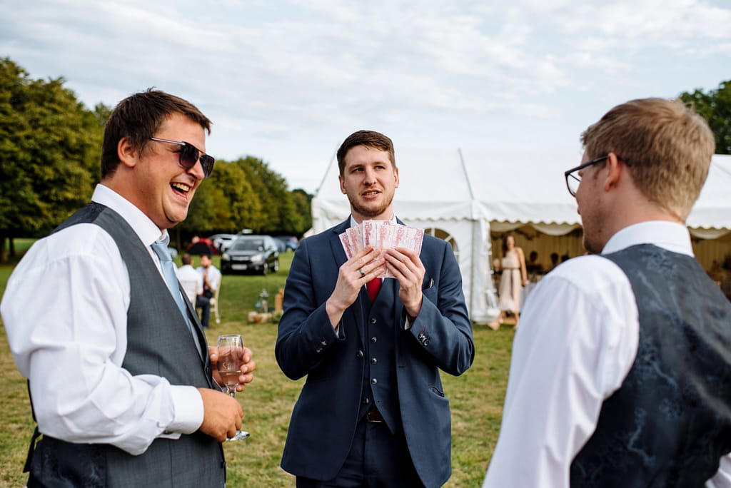 Wedding guests enjoying interactive close-up magic in Bromley.