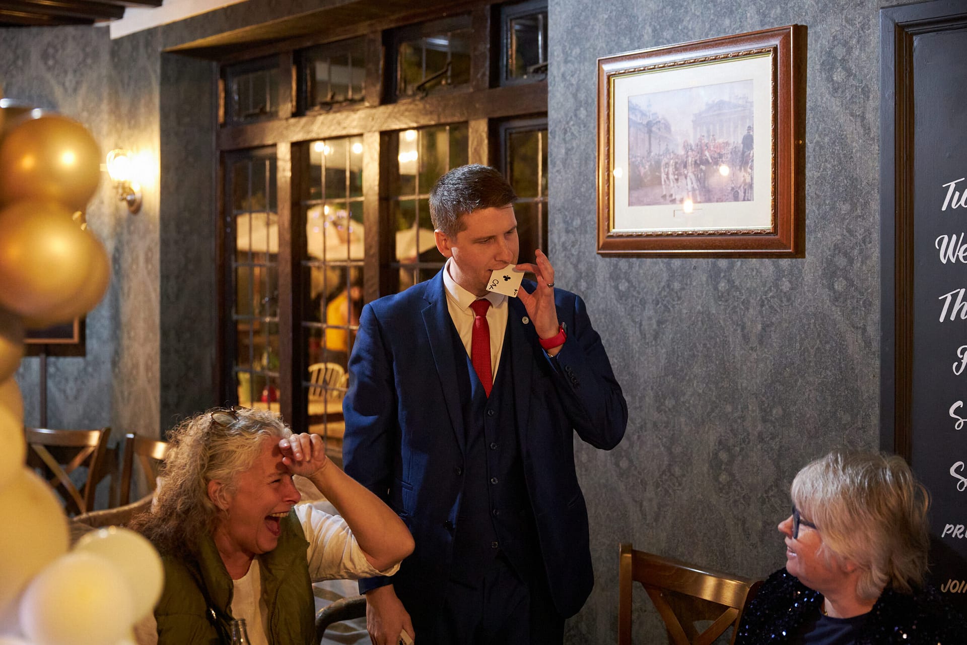 Guests enjoying interactive magic at a birthday celebration in Kent.