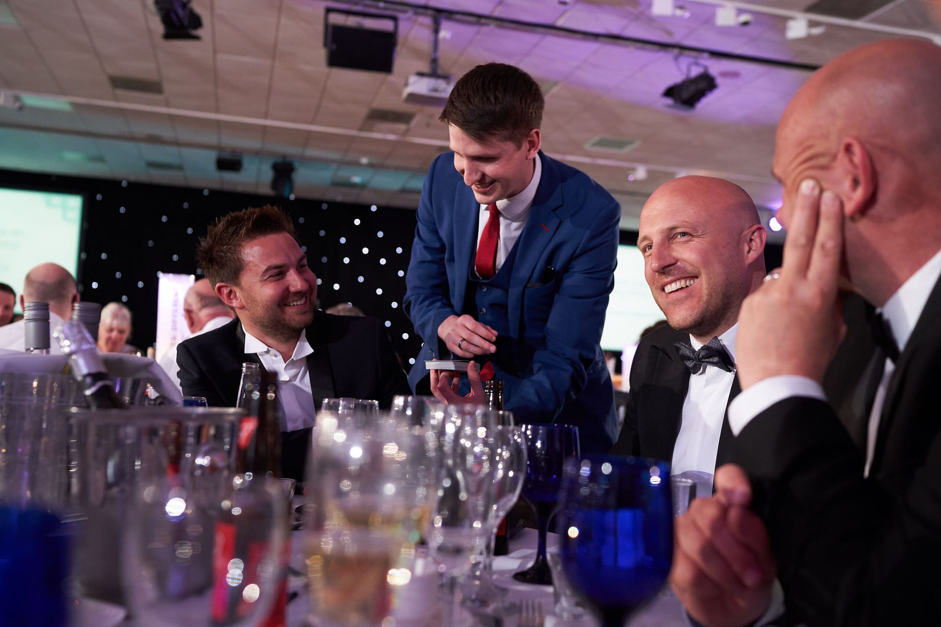 Professional magician engaging colleagues at a company event in Surrey.